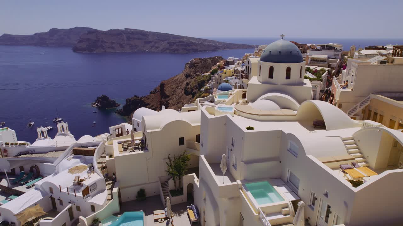 Stunning Oia Village in Santorini, Greece with White Buildings and Blue Domes