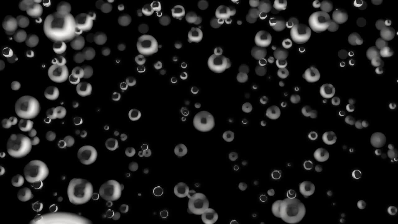 물방울이 어두운 배경에 천천히 떨어지고 있습니다.