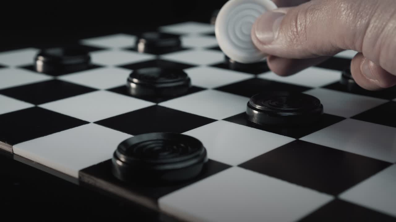 Checkers - A man winning the game turning all the black pieces into white in one CRAZY move