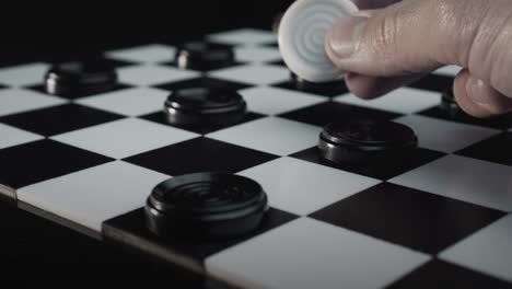 checkers - a man winning the game turning all the black pieces into white in one crazy move