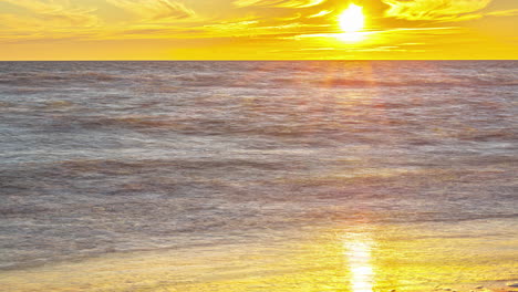 golden sunset timelapse of an empty beach