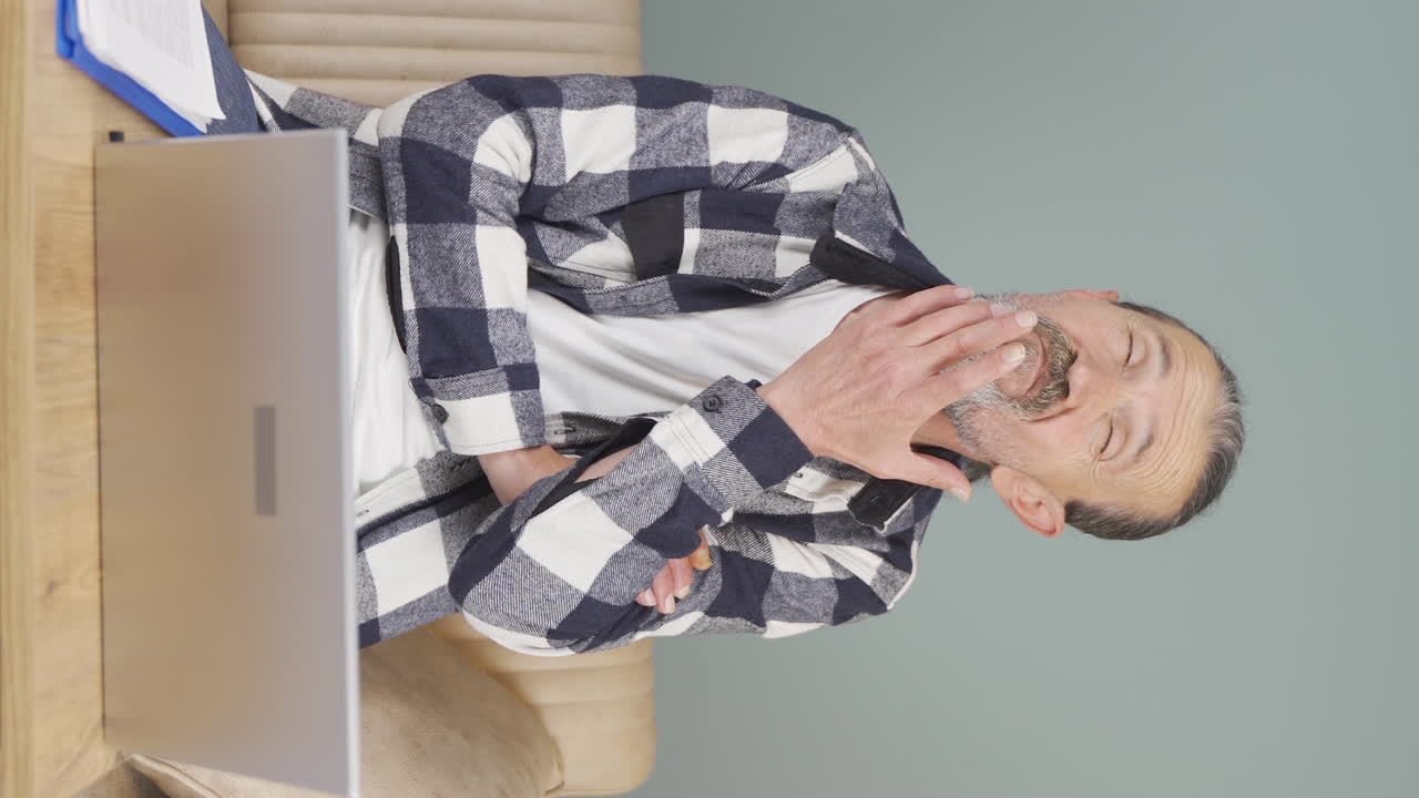 Vertical video of Confused old man thinks and can't figure it out.