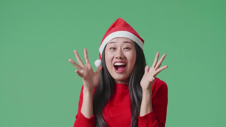 Excited Woman Wearing Santa Hat