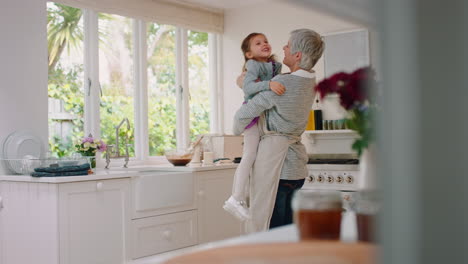 family, kitchen and grandmother lifting girl