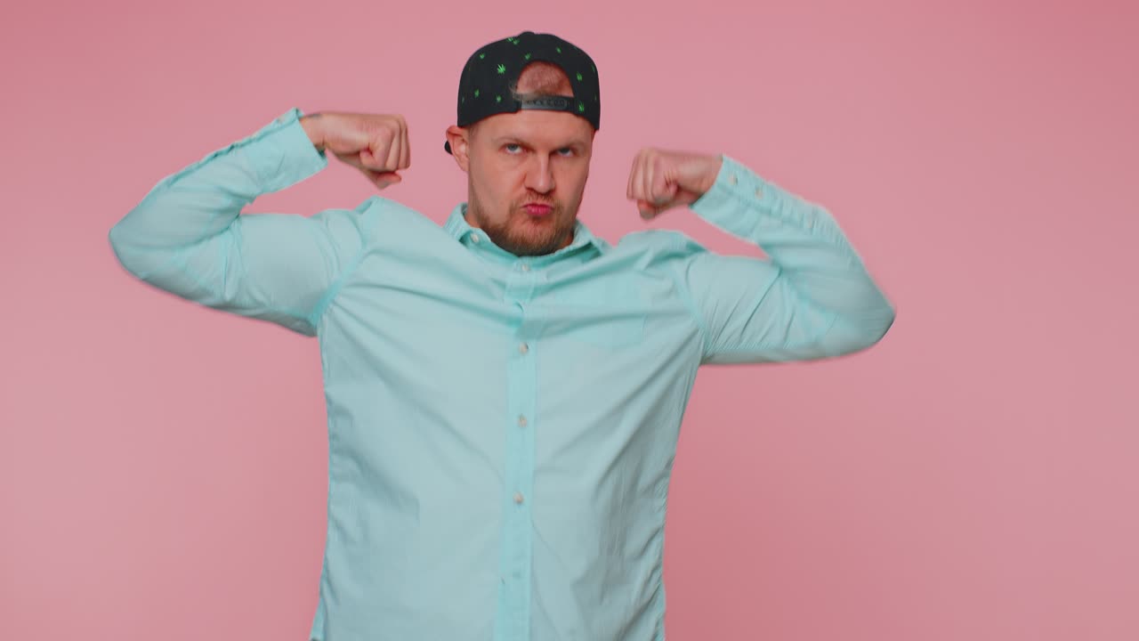 Man showing biceps and looking confident feeling power strength to fight for rights success win