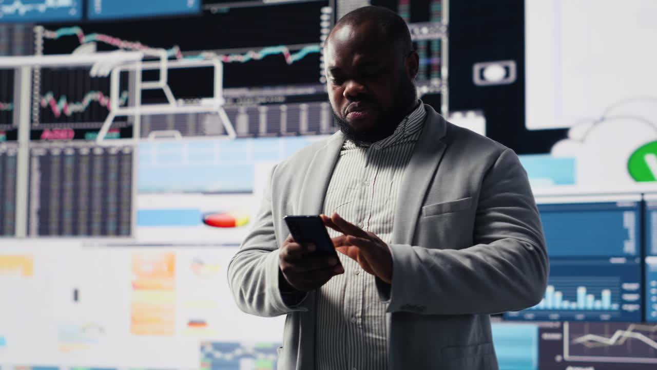 African american specialist checking big data fintech reports on phone app