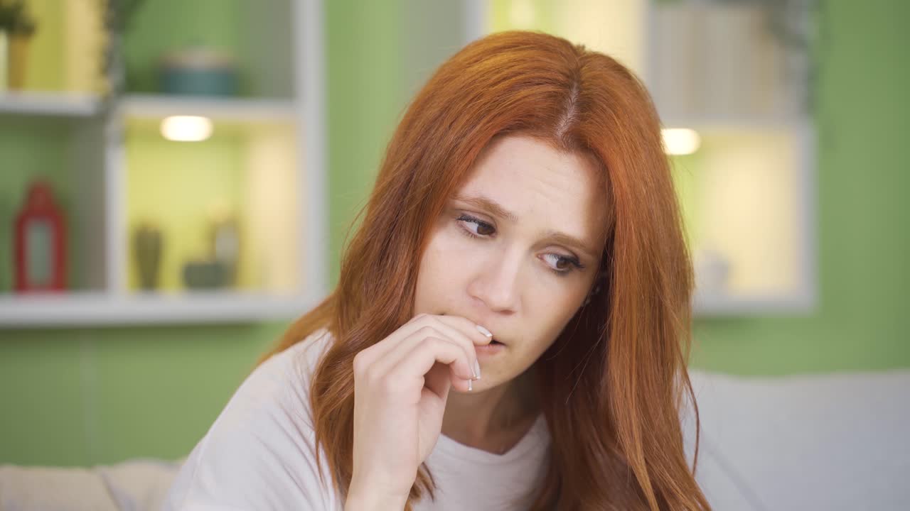 Stressed young woman. Thoughtful young woman is worried.