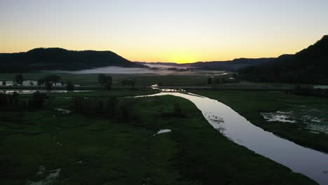 misty sunrise over valley river landscape