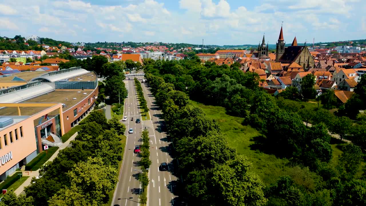 4K Aerial Drone Video of the St. Johannis Kirche Church, Kirche St. Gumbertus Church, and Brücken-Center Ansbach Shopping Mall in Ansbach, Germany