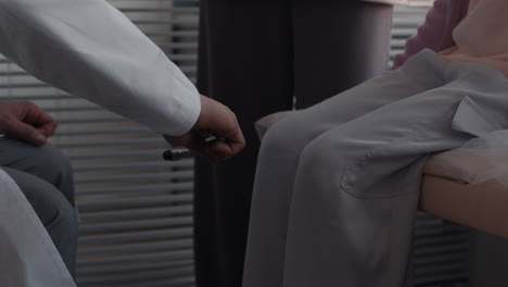neurological examination with reflex hammer