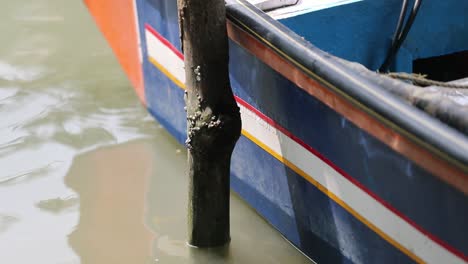 Close-up-gimbal-shot-of-stake-near-boat