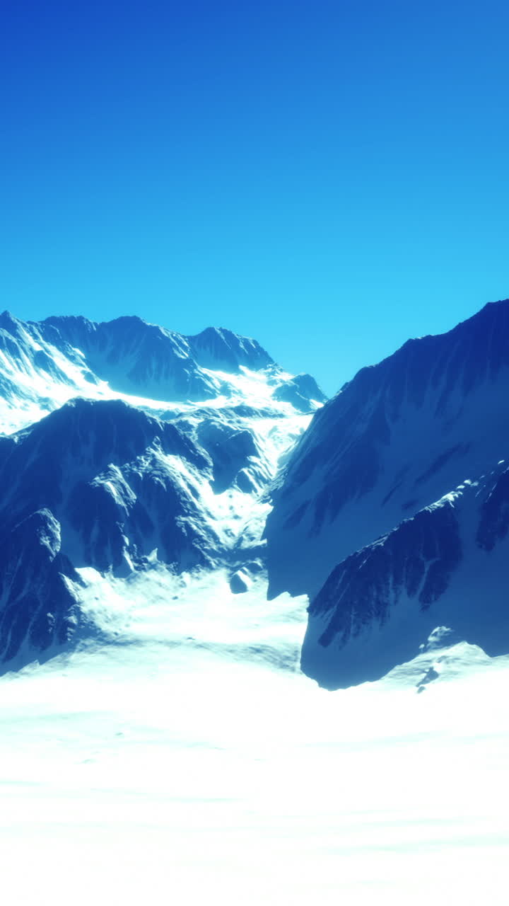 Majestic mountain range under clear blue sky with endless snow