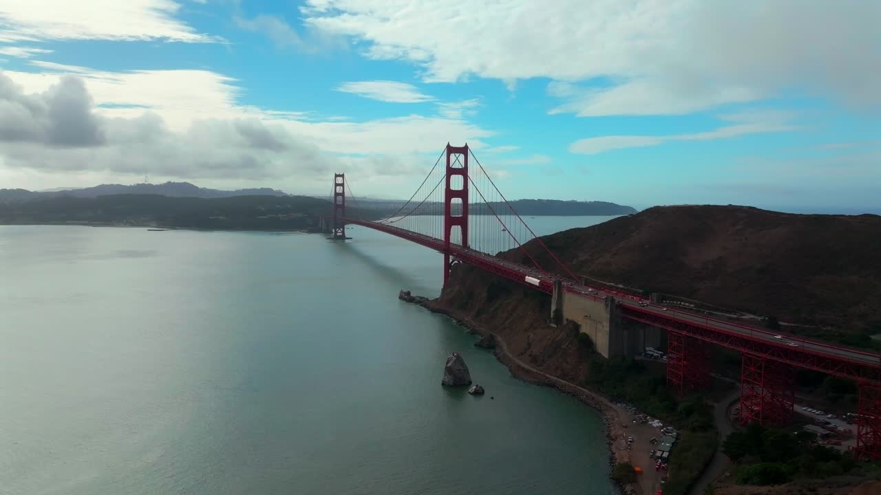 San Francisco Golden Gate Bridge aerial drone California Point Cavallo Needles Rock Horseshoe Bay Area Dana Bowers Vista Point cloudy mist misty fog blue skies Sausalito cars traffic forward motion
