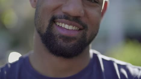 Close-up-short-of-Afro-American-male-mouth-saying-oh,-smiling