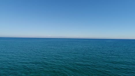 aerial view of meteorology tower in the middle of beautiful sea- 4k video