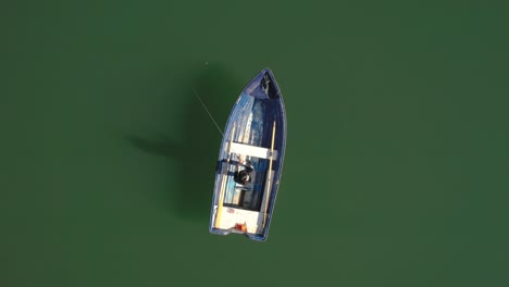 Woman-on-the-boat-catches-a-fish-on-spinning-in-Norway.