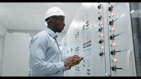 engineer working on a control panel