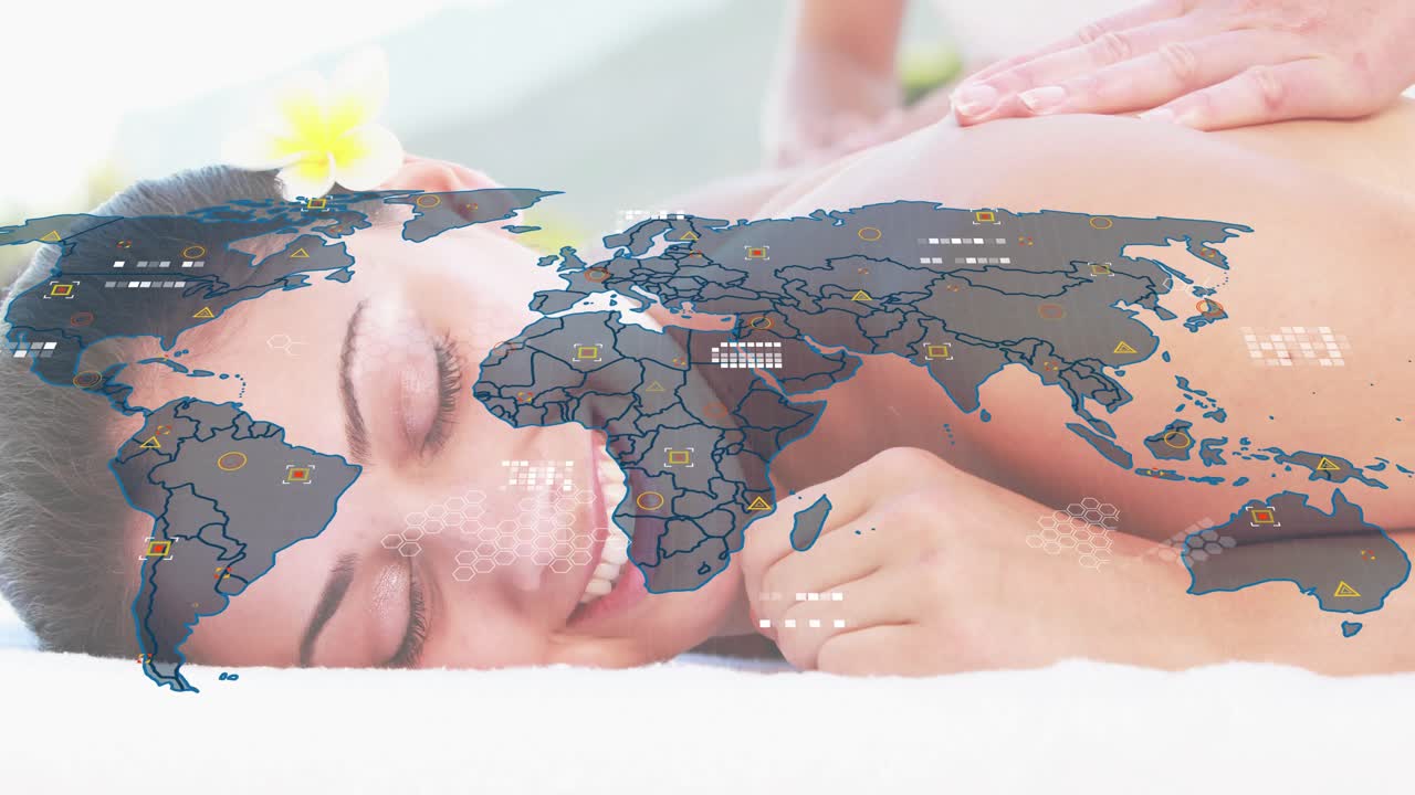 Spa therapist pressing back, applying oil, kneading muscles under map overlay, releasing tension