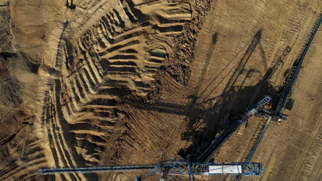 birds eye view of a huge blue crane with an excavator