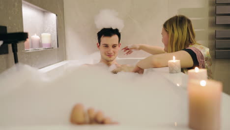 couple relaxing in a bubble bath