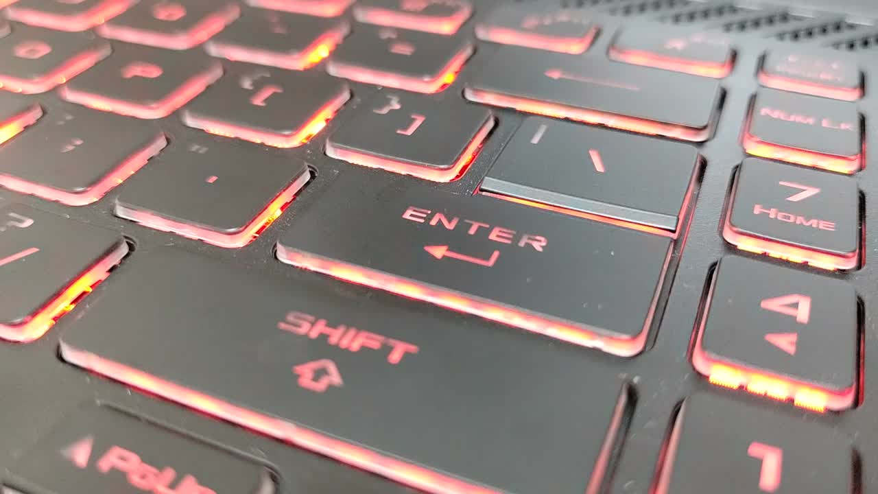 Red backlit gaming laptop keyboard. Perfect for high-performance gaming setups and intense sessions.