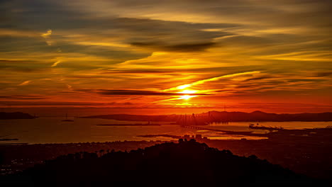 san francisco sunrise time lapse with orange and yellow skies across oakland viewpoint