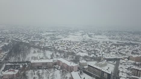 aerial view of small town covered in snow