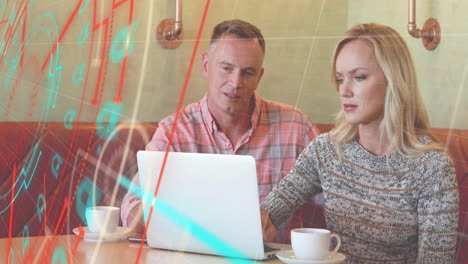 Animation-of-scanner-processing-data-over-caucasian-male-and-female-colleague-using-laptop-at-cafe