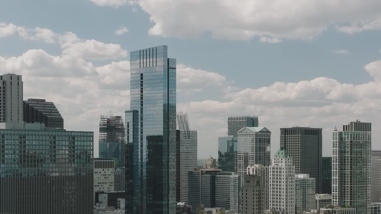 Sky view of Chicago showcasing buildings and clouds during the day
