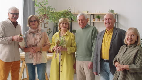 portrait of cheerful senior friends at home