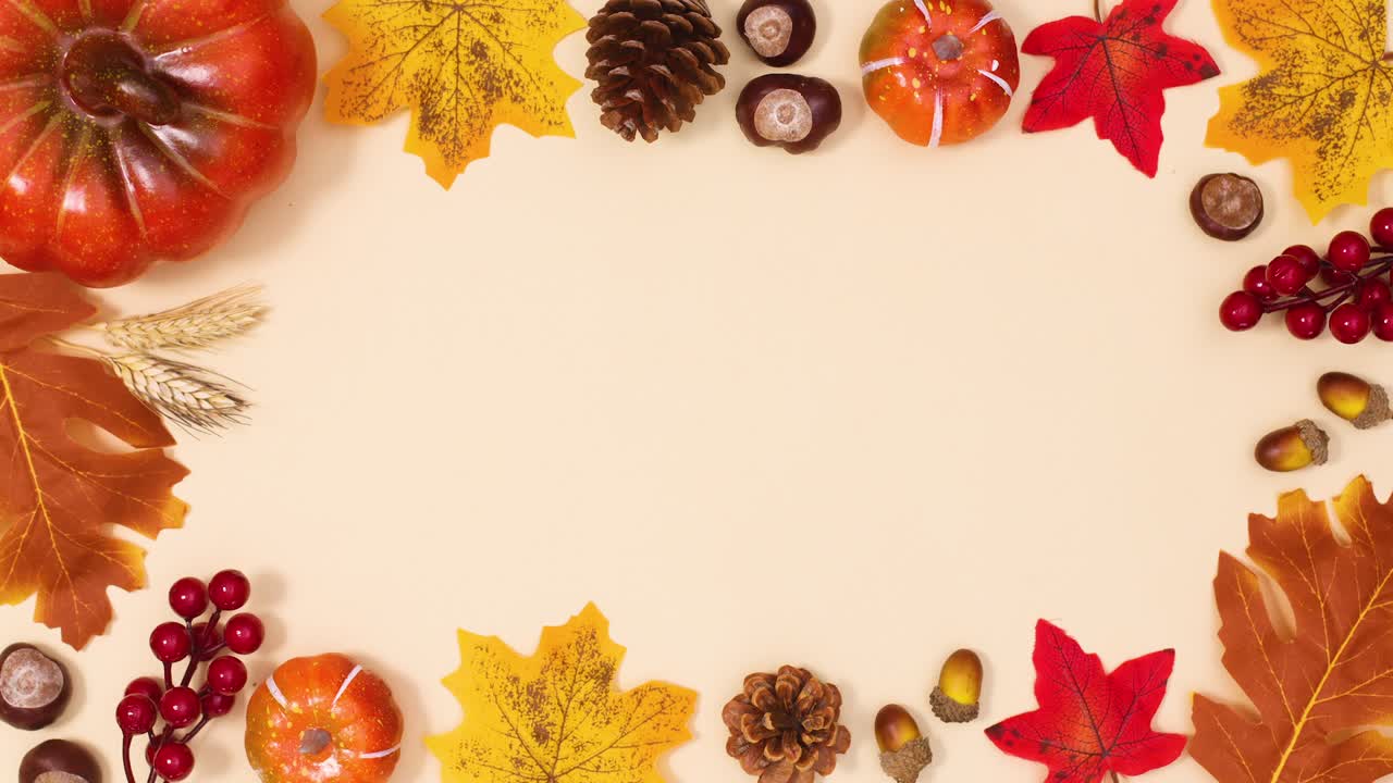 Autumn leaves and fruits make frame for text. Stop motion