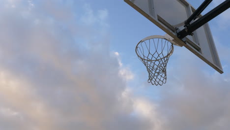 View-Below-The-Basket---Player-Doing-Layup-Shot-At-The-Basketball-Court-In-Vancouver,-Canada---low-angle-shot