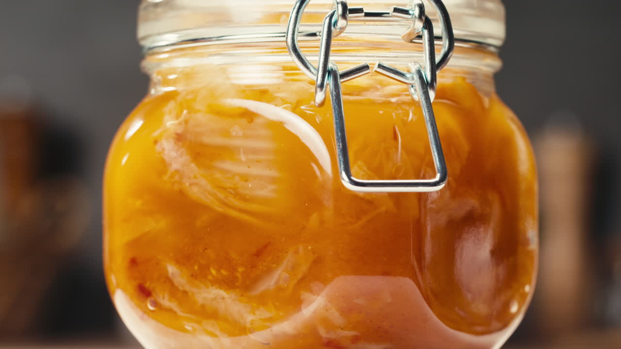 Close-up of fermented spicy cabbage kimchi with in can. Preservation of vegetables in glass jars. Fermentation preserved kimchi cabbage with spices. Asian cuisine.