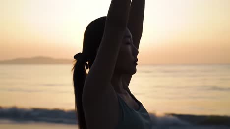 captivating sunrise yoga at the beach: a serene journey of self-discovery and inner peace as a woman embraces the morning light with open arms