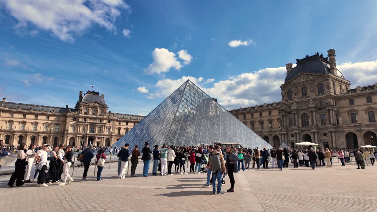 Louvre Museum pyramid outside Paris France capital city touristic landmark