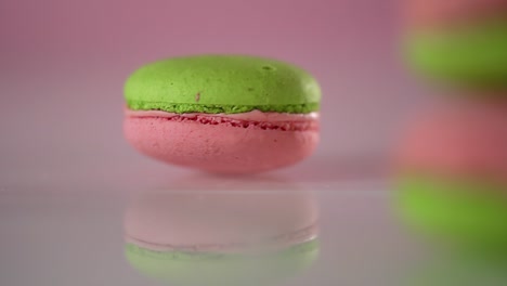 a delicious pistachio and strawberry macaroon spinning around in slow motion