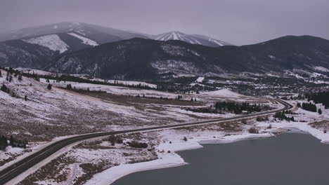 lake dillon keystone summit cove highway colorado aerial cinematic drone cloudy snowy winter morning view frisco breckenridge silverthorne ten mile range peaceful calm frozen ice forward reveal