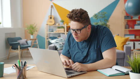 man reacting to computer