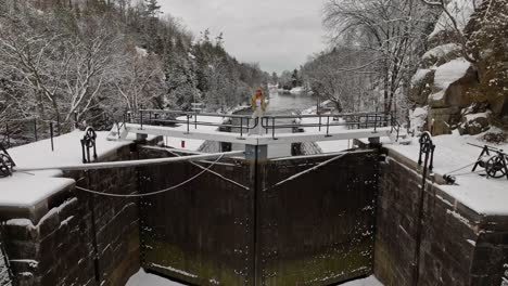 One-women-enjoying-a-winter-day-with-fresh-snow-on-trees-in-the-background-,-dolly-shot