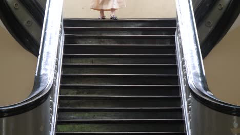 steps leading to the museum of ho chi minh city in vietnam with woman descending