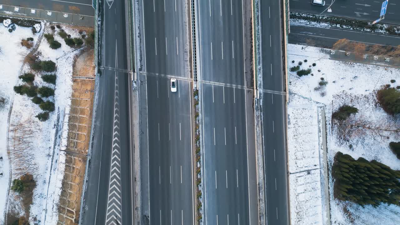 An aerial perspective captures the Qingdao-Yinchuan Expressway in Shandong Province, China, with car traffic flowing below