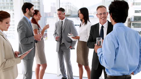 Business-people-standing-and-talking-