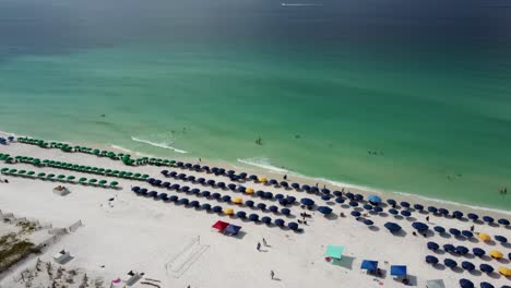 aerial panoramic view of tropical beach with umbrella and chair at a luxury resort in florida, united states and coastline with colorful cloud and blue sky, gulf of mexico