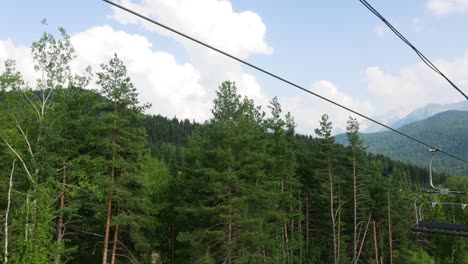 mountain ski lift ride through the forest