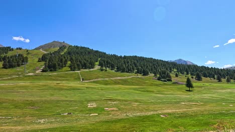 lush green hill with clear blue sky