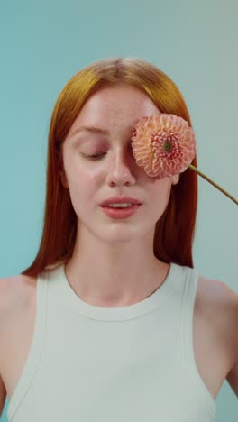 woman with dahlia flower