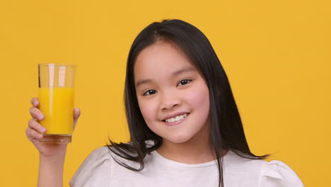 smiling girl with orange juice