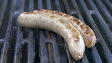 preparing fresh german sausages on the bbq grill, barbeque in germany