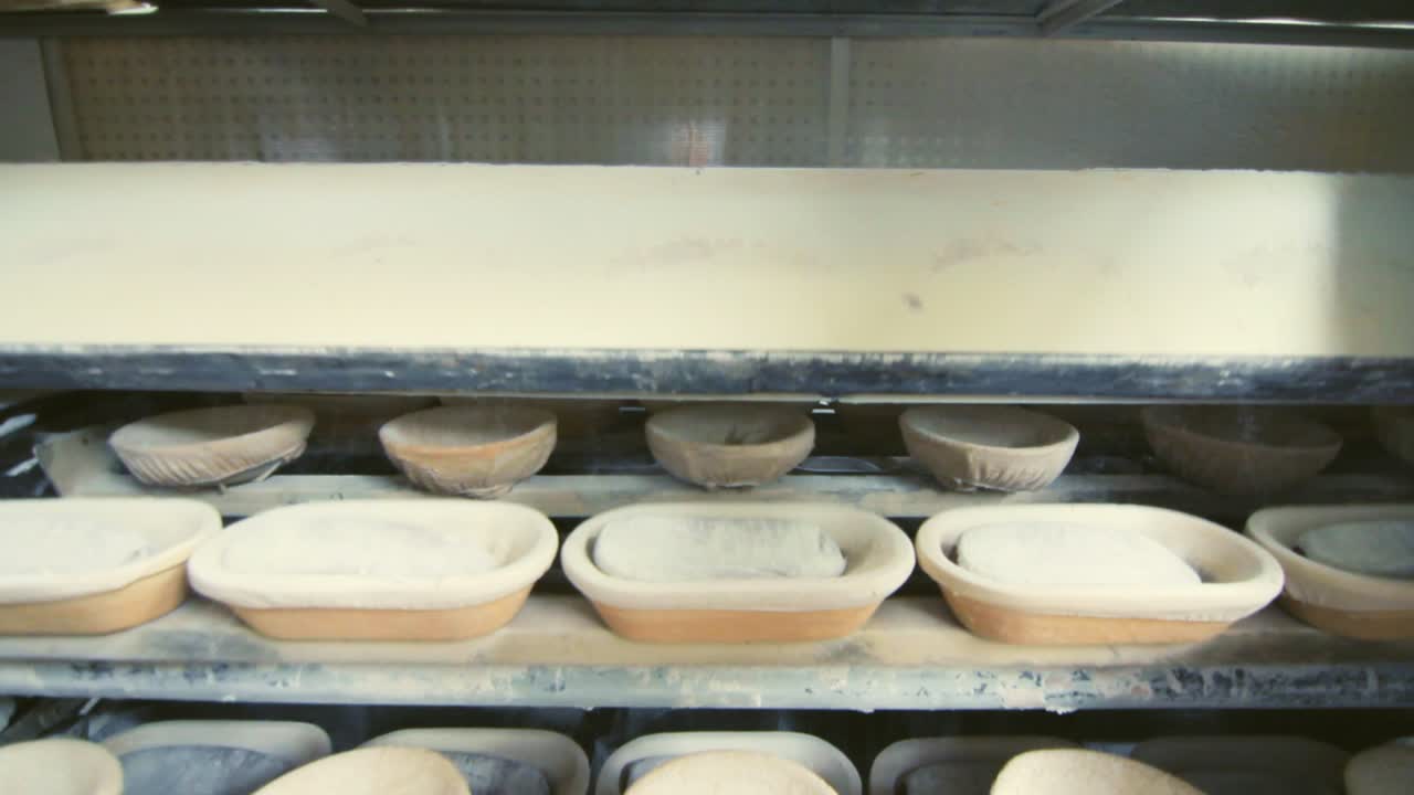 Bakery production process at food factory. Working process at bakery factory