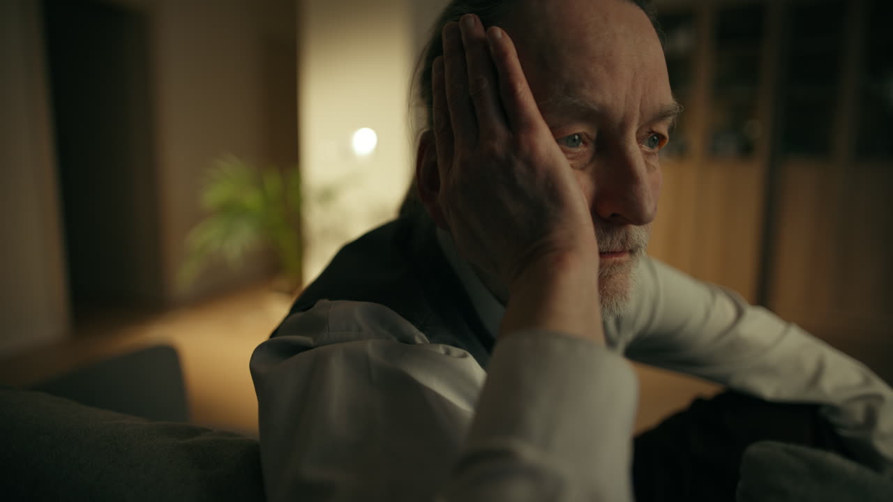 Elderly Man Looking Pensive and Sad Indoors